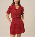 Alba - Vestido rojo con mangas abullonadas y cuello de lunares